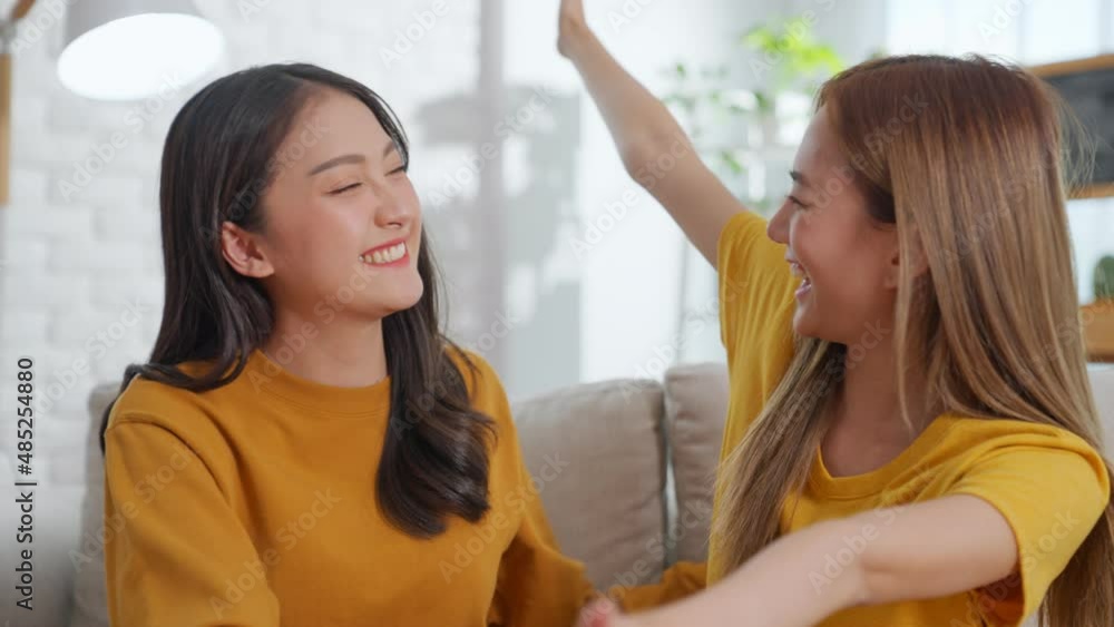 Shot in slow motion. Young asian homosexual female bring a ring is making surprise proposal of marriage to her beloved woman.Lesbian, Gay, Bisexual, Queer. Transgender couple propose marry. LGBTQ+. Shot in slow motion. Young asian homosexual female bring a ring is making surprise proposal of marriage to her beloved woman.Lesbian, Gay, Bisexual, Queer. Transgender couple propose marry. LGBTQ+.