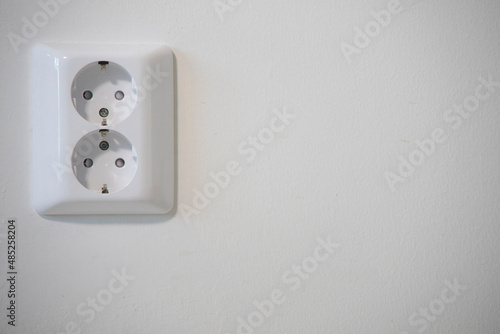 A double European electrical outlet on a wall.