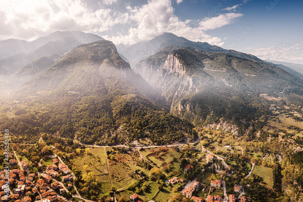 Aerial drone panoramic view of deep gorge and rocky ridge leading to legendary Mountain Olympus - the pantheon of all Greek gods and Great Zeus. Natural and National Parks in Greece