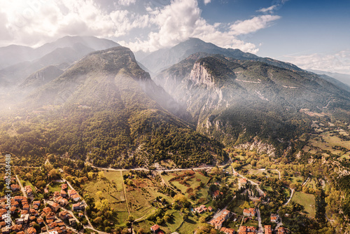 Obraz na płótnie Aerial drone panoramic view of deep gorge and rocky ridge leading to legendary Mountain Olympus - the pantheon of all Greek gods and Great Zeus. Natural and National Parks in Greece w salonie