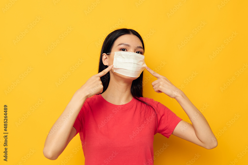 Portrait Asian beautiful young woman in red t-shirt medical mask protection Lifestyle unaltered Portrait Asian beautiful young woman in red t-shirt medical mask protection Lifestyle unaltered