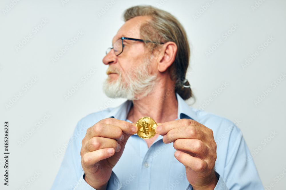 Portrait elderly man cryptocurrency bitcoin investment light background Portrait elderly man cryptocurrency bitcoin investment light background
