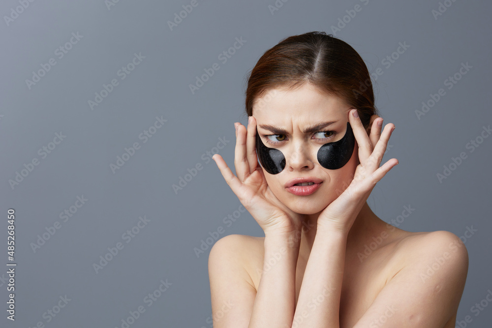 woman with patches on the face clean skin health rejuvenation close-up Lifestyle woman with patches on the face clean skin health rejuvenation close-up Lifestyle