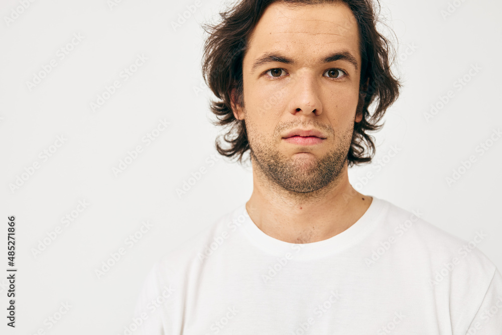 Attractive man in a white T-shirt hand gesture Lifestyle unaltered Attractive man in a white T-shirt hand gesture Lifestyle unaltered