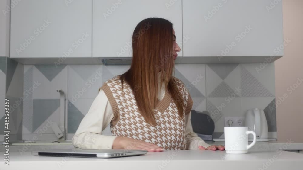 Panning shot of businesswoman finishing working on laptop then leaving workplace Panning shot of businesswoman finishing working on laptop then leaving workplace