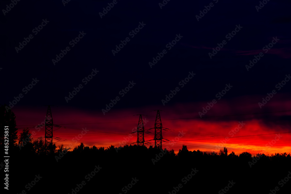 Fototapeta premium Bright red order and electric transmission towers