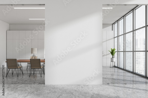 Fototapeta Light office room behind glass doors, panoramic windows and mockup