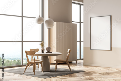 Bright living room interior with empty white poster, panoramic window photo