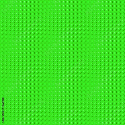 Green plastic baseplate from popular brand children constructor with assembly knots
