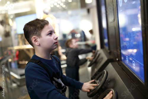 Child playing car simulator game