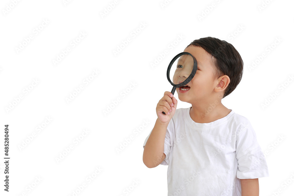 Asian little baby boy looking through a magnifying glass to beside isolated on white background with copy space Asian little baby boy looking through a magnifying glass to beside isolated on white background with copy space