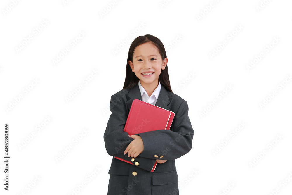 Smiling Asian little schoolgirl in formal wear shirt, business suit hug a book while looking at camera isolated on white background. Image with Clipping path. Smiling Asian little schoolgirl in formal wear shirt, business suit hug a book while looking at camera isolated on white background. Image with Clipping path.
