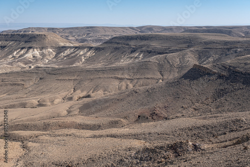 View of Ramon Crater from West to East as seen from Mount Ramon, a 500 m deep, the world's largest erosion cirque, located in the Negev Desert, south of Beer Sheba, Israel. 