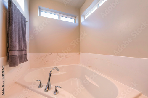 Alcove bathtub with widespread stainless steel faucet
