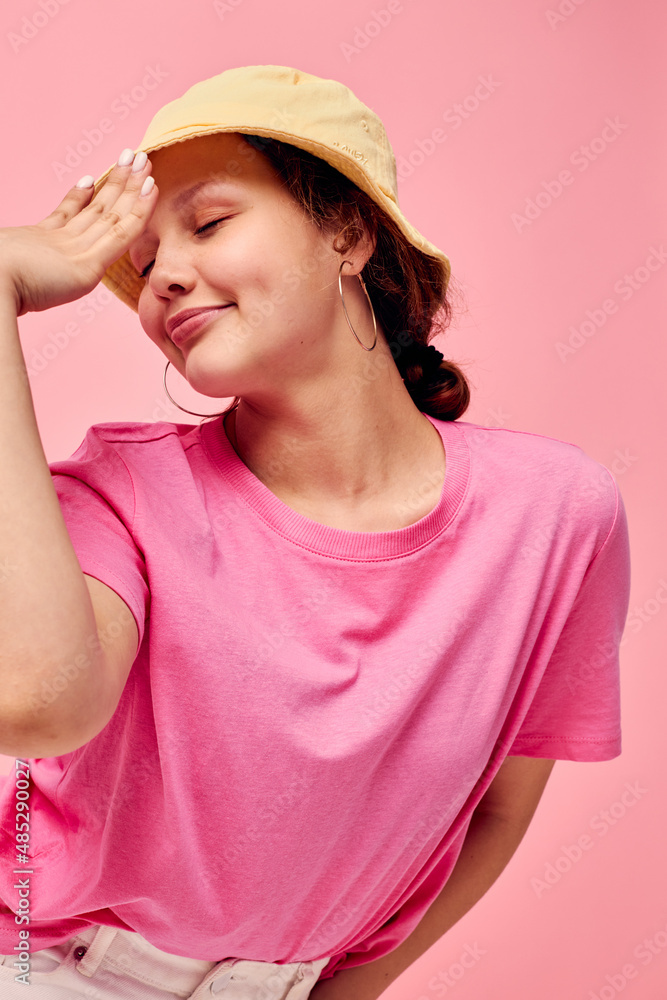 Stylish teenager girl model In beige Panama pink t-shirt hand gestures Lifestyle Stylish teenager girl model In beige Panama pink t-shirt hand gestures Lifestyle