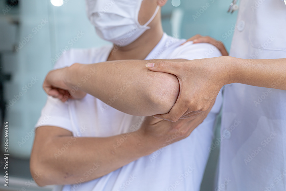 Physiotherapist is doing physical therapy for a patient, the patient has body aches due to overwork and has undergone treatment and physiotherapy with a professional physiotherapist. Physiotherapist is doing physical therapy for a patient, the patient has body aches due to overwork and has undergone treatment and physiotherapy with a professional physiotherapist.