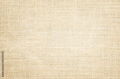 Jute hessian sackcloth burlap canvas woven texture background pattern in light beige cream brown color fiber linen and cotton cloth texture as clean empty for decoration.