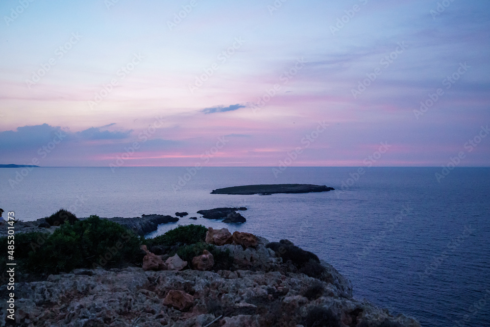 Far de Cavalleria, Menorca. September 2021. Wonderful sunset over the Mediterranean Sea from the island of Menorca.