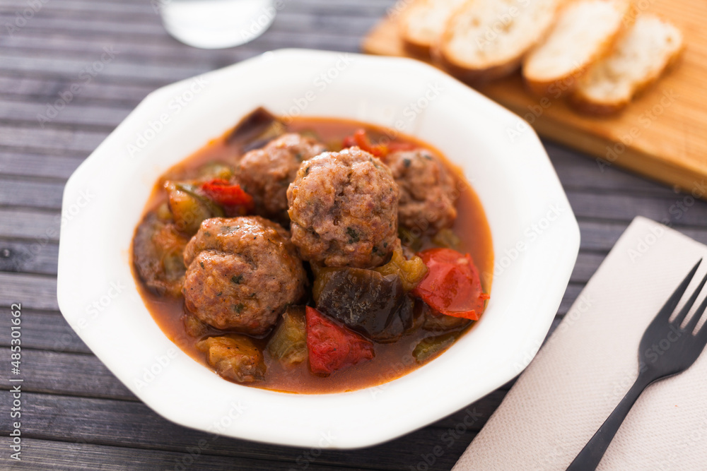 cooked meatballs with stewed eggplant in bowl cooked meatballs with stewed eggplant in bowl