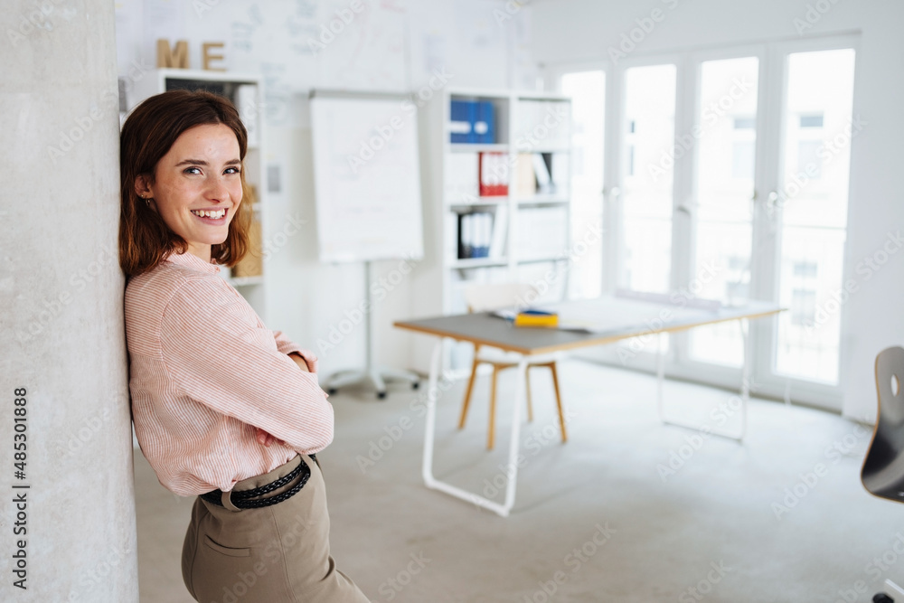 Relaxed happy businesswoman looking at camera with warm smile Relaxed happy businesswoman looking at camera with warm smile