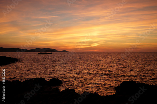 Cala Viola de Ponent  Menorca. September 2021. Magnificent sunset in the Mediterranean Sea. On one of the paradisaical beaches of the island of Menorca.