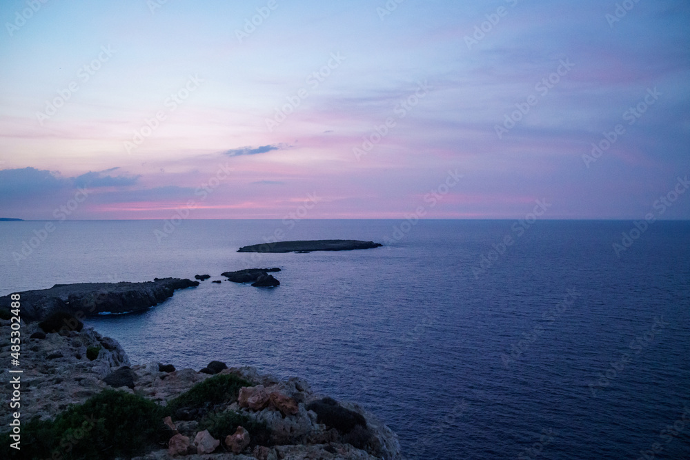 Far de Cavalleria, Menorca. September 2021. Wonderful sunset over the Mediterranean Sea from the island of Menorca. Far de Cavalleria, Menorca. September 2021. Wonderful sunset over the Mediterranean Sea from the island of Menorca.