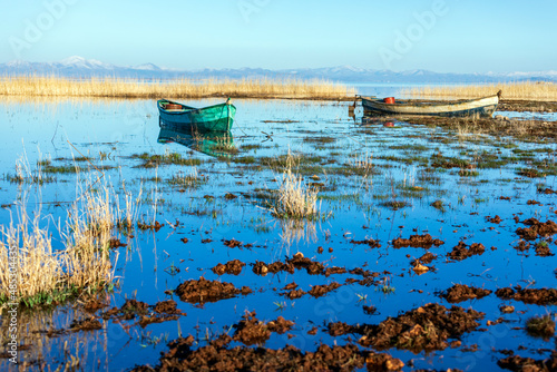 Fishing boat on the Beysehir Lake. Lake Beysehir (Turkish: Beysehir Golu), or Caralis or Karalis is a large freshwater lake in Isparta and Konya provinces in southwestern Turkey. photo