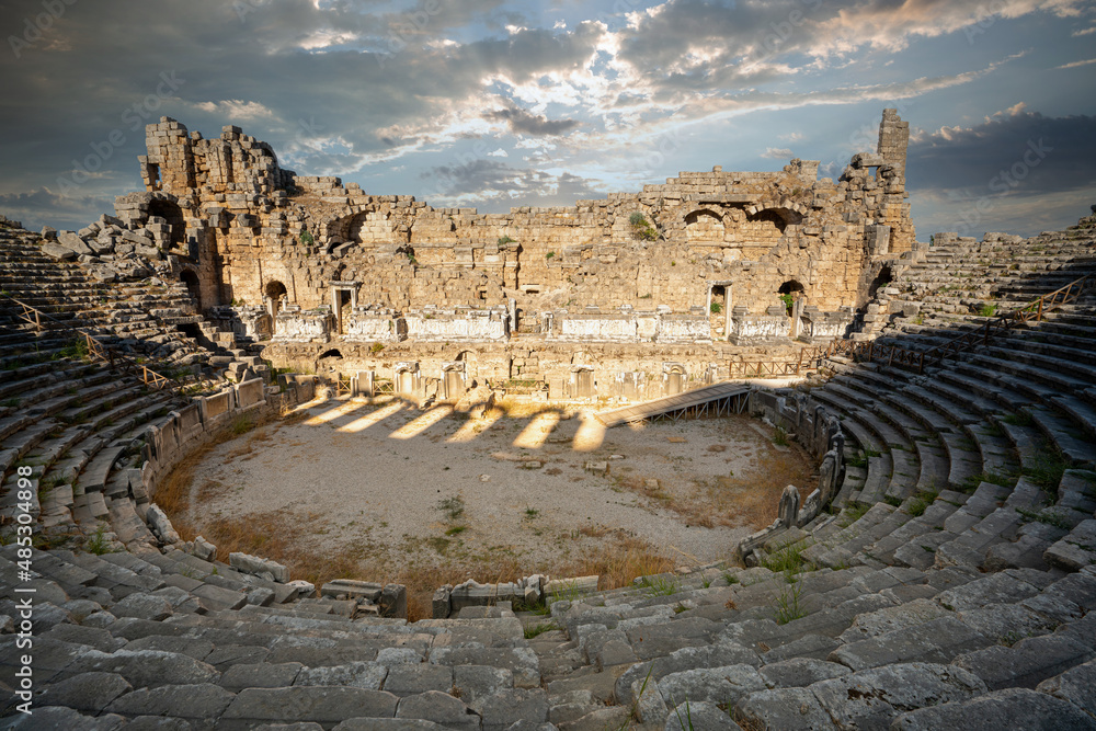 The ruins of the ancient amphitheater (Theater) in Perge. Built in the Greco-Roman style, Perge is an ancient Greek city in Antalya, on Turkey's southern Mediterranean coast.