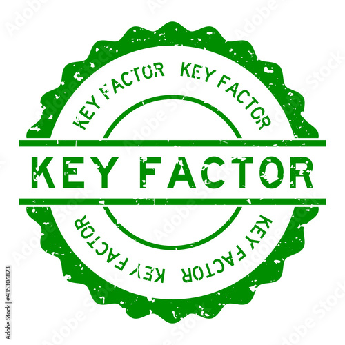 Grunge green key factor word round rubber seal stamp on white background