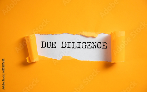 due diligence text on torn paper