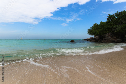 An epic view of the sky, sea, and beach. Nature background to a romantic tropical destination.