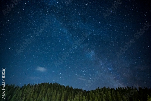 Night landscape with field on hills and Milky way sky in bulgaria.