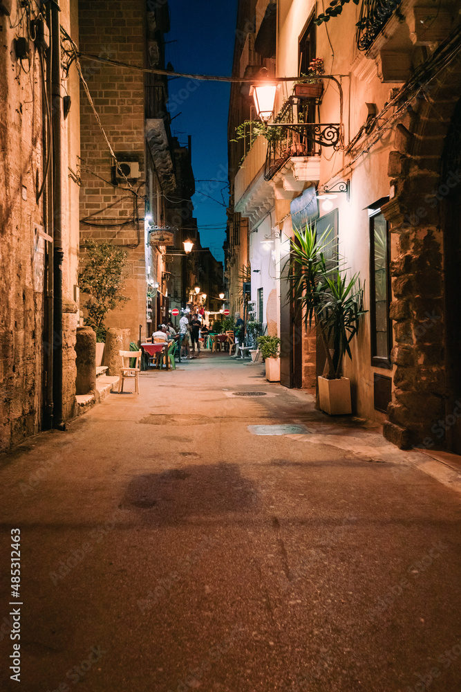 Historical centre with people at night, old town of Taranto