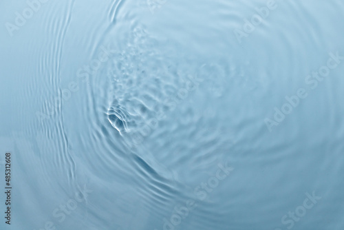 Blue water texture, blue pure water surface with waves and ripples. Flat lay, copy space