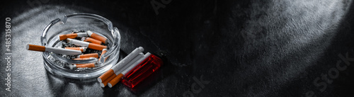Foto Composition with an ashtray and cigarettes