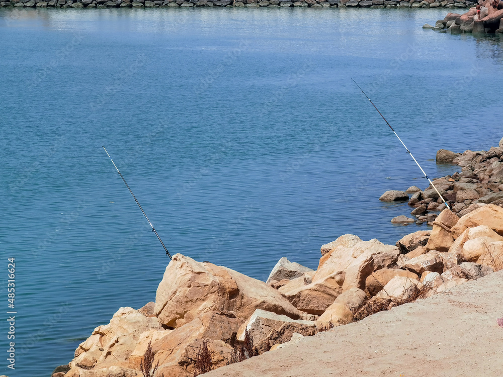 Fisherman fishing on a Moroccan beach Fisherman fishing on a Moroccan beach