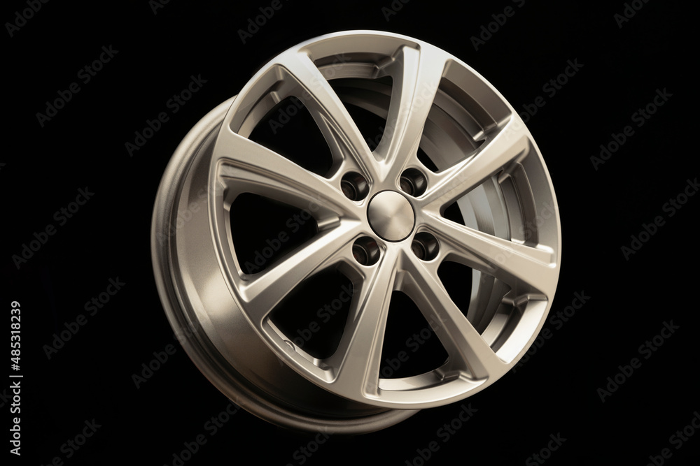 new modern alloy wheel on black background