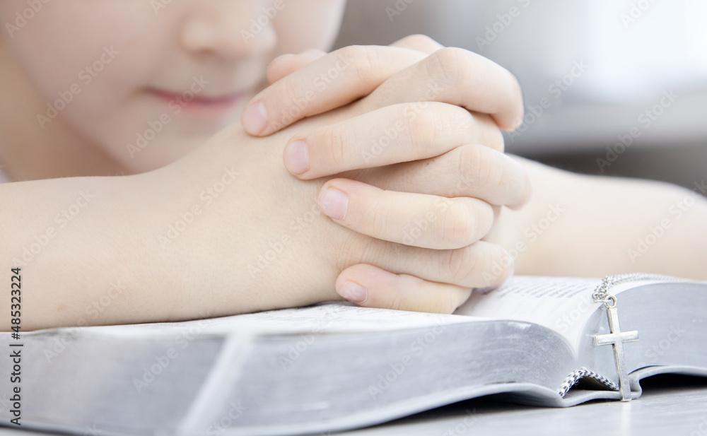 Christian faith. Reading the bible. Hands praying to God with a Bible. Beg for forgiveness and believe in goodness. Concept for faith, spirituality and religion. Christian faith. Reading the bible. Hands praying to God with a Bible. Beg for forgiveness and believe in goodness. Concept for faith, spirituality and religion.