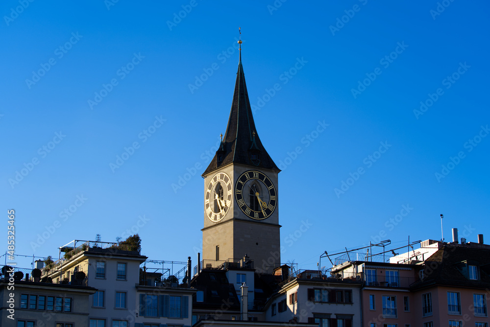 Church tower of medieval protestant church St. Peter at the old town of Zürich on a sunny winter day. Photo taken February 5th, 2022, Zurich, Switzerland.