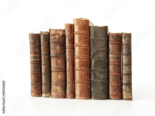 stack of unique antique books isolated on white.