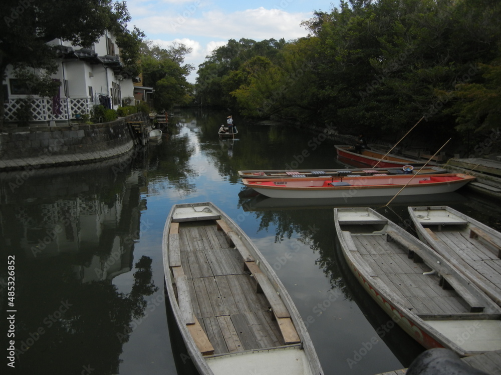 The scene of a moat and excursion boats of a riverside district of Yanagawa City in Fukuoka Prefecture in Japan 日本の福岡県柳川市の水郷地帯の掘割と遊覧ボートの一風景