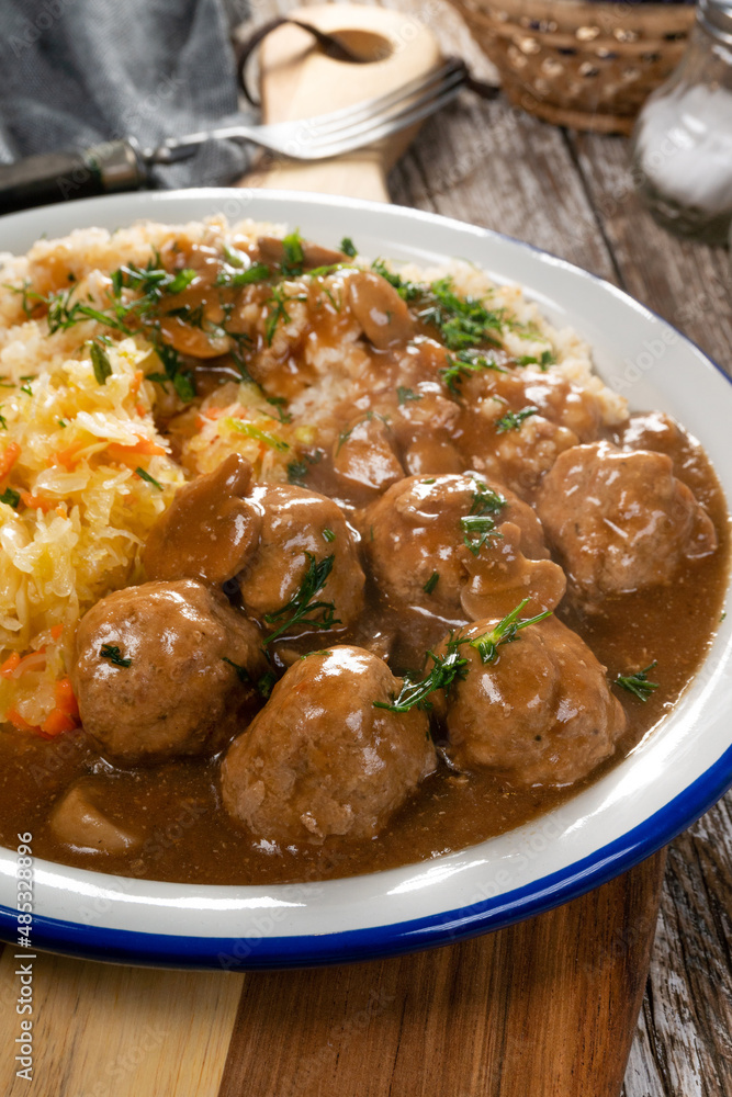 Minced meat balls in mushroom sauce.
