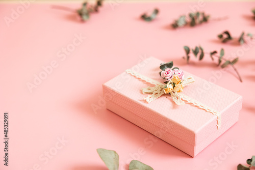 Beautiful pink gift box isolated on pastel background. Gift for holiday, birthday, Wedding, Mother's Day, Valentine's day, Women's Day. Copy space. Top view, flat lay.