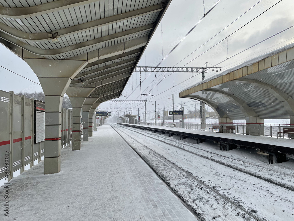 Empty railway platform without passengers in winter at the sunset. Empty railway platform without passengers in winter at the sunset.