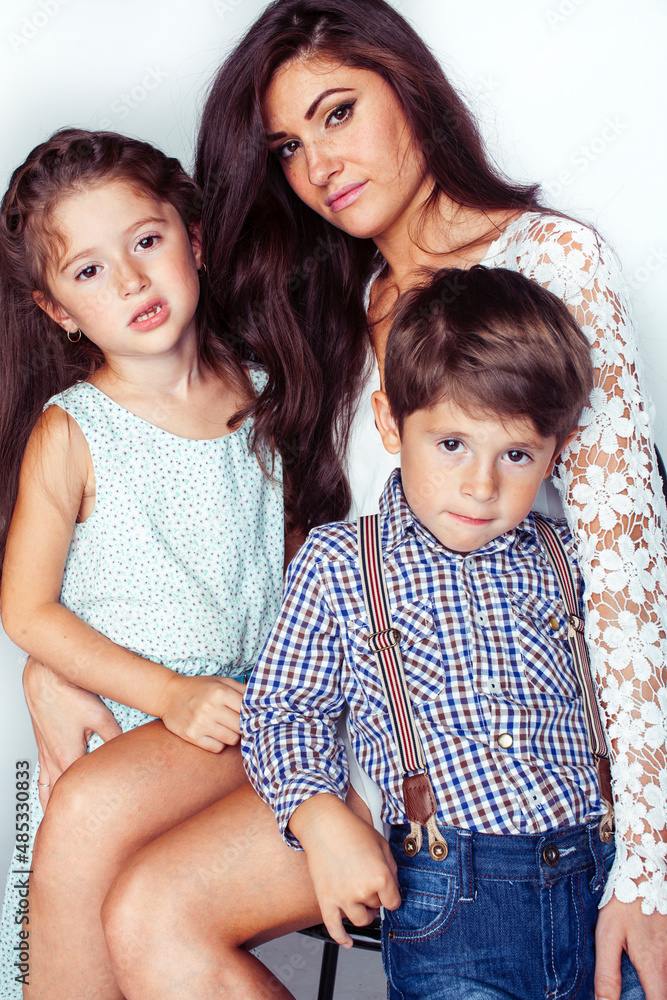 young mother with two children on white background isolated, happy smiling family, lifestyle people concept young mother with two children on white background isolated, happy smiling family, lifestyle people concept