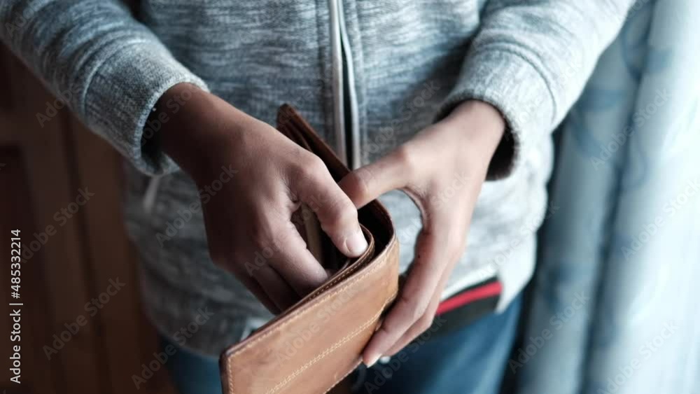 slow motion of man hand open an empty wallet with copy space. slow motion of man hand open an empty wallet with copy space.