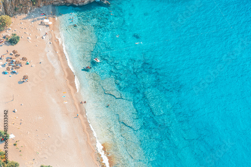 Fototapeta Naklejka Na Ścianę i Meble -  Spectacular view of the clear beach and turquoise water of Butterfly Valley. Butterfly Valley (Turkish: Kelebekler Vadisi) is a valley in Fethiye district of Mugla Province, Turkey.