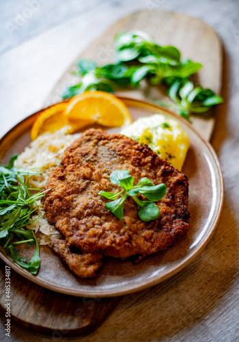 Pork breaded cutlet coated with breadcrumbs with mashed potatoes