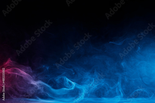 Abstract image of dark room concrete floor. Black room or stage background for product placement.Panoramic view of the abstract fog. White cloudiness, mist or smog moves on black background.  © KDdesignphoto