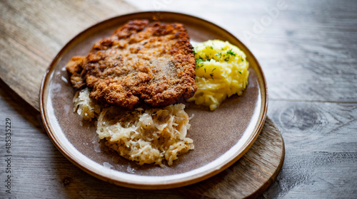 Pork breaded cutlet coated with breadcrumbs with mashed potatoes